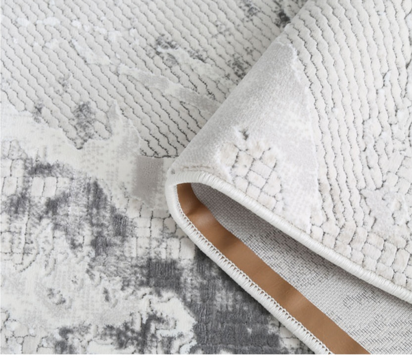 Edge and backing detail of the ELEGAND rug collection